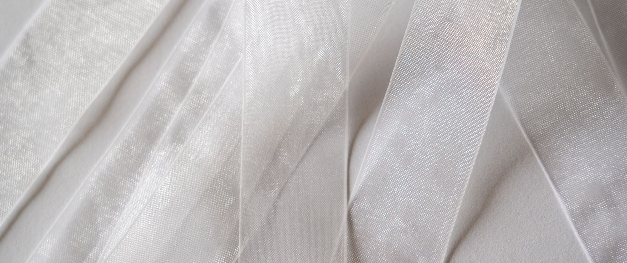 Folds of sheer ivory silk