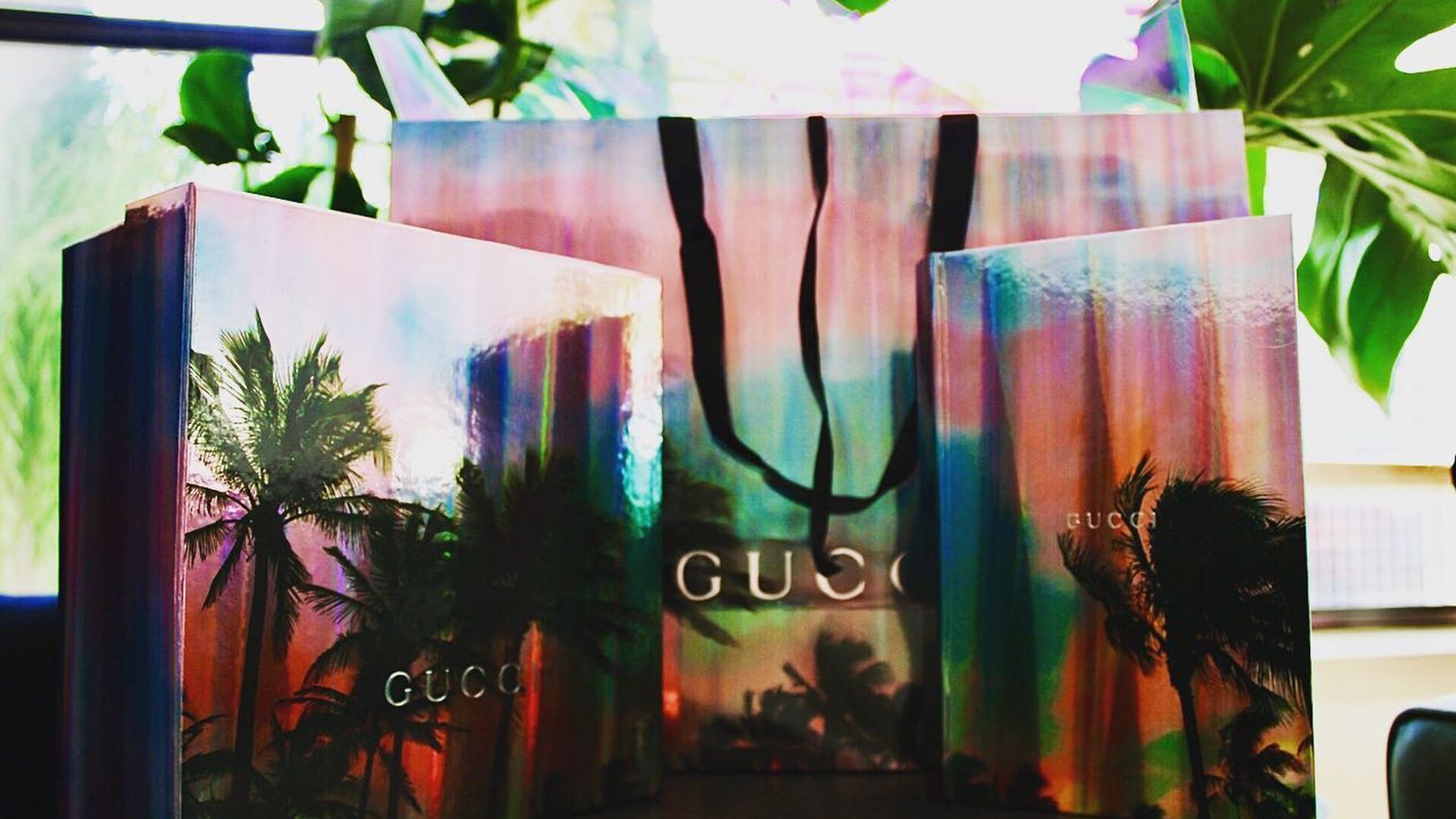 Iridescent Gucci boxes and gift bag from an Elite Eye presentation