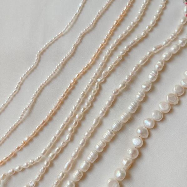 Freshwater pearl necklaces laid out together